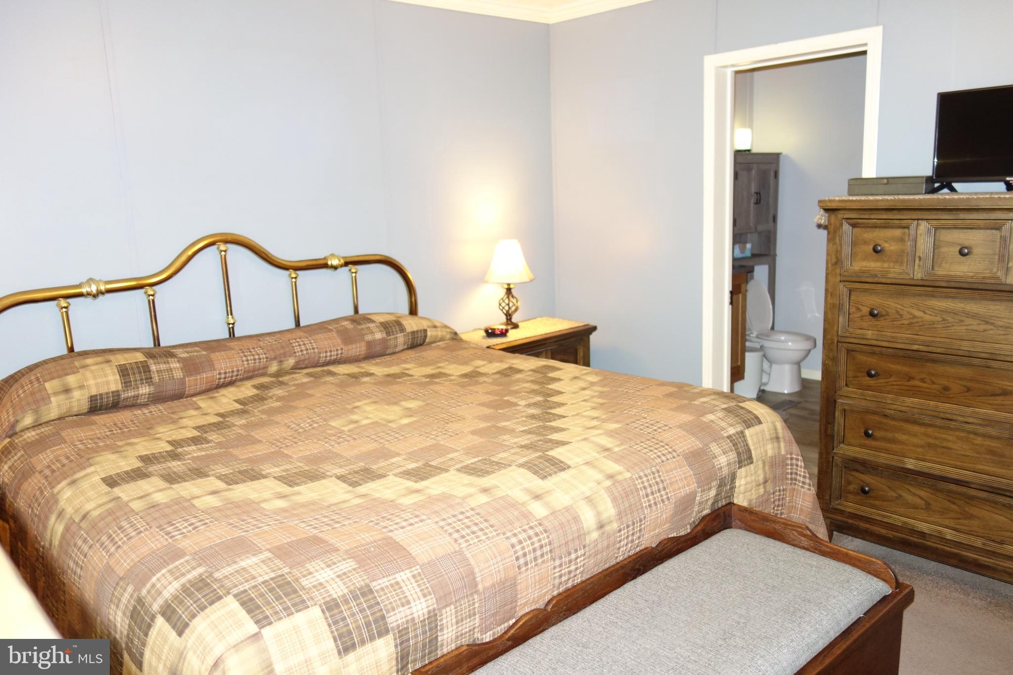 106 Circle Drive Nottingham, PA 19362 - Photo 12 of 16 a bedroom with a bed and a flat screen tv