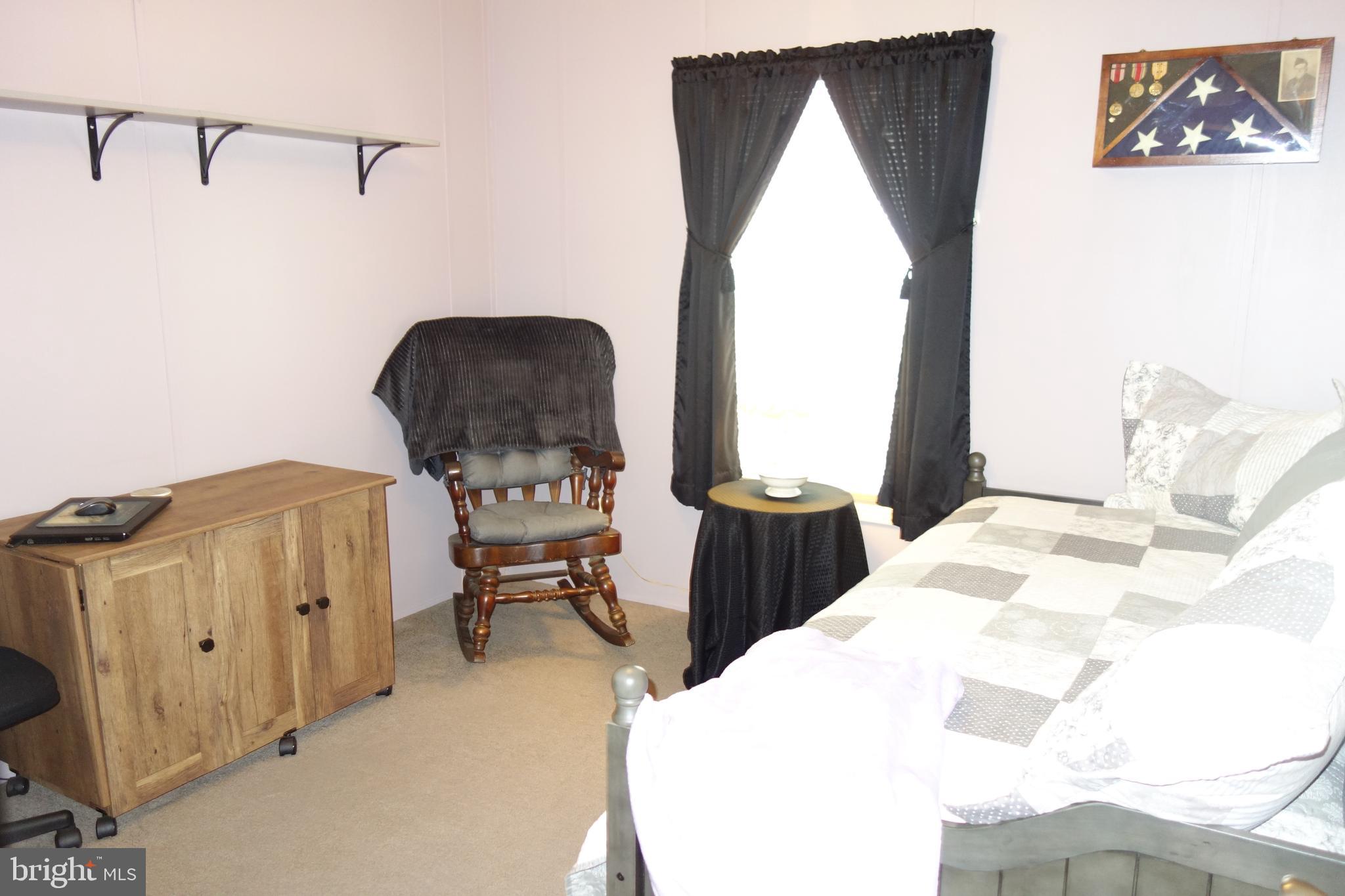 106 Circle Drive Nottingham, PA 19362 - Photo 14 of 16 a bedroom with a bed and wooden floor