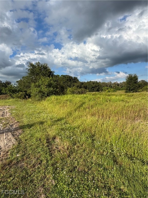 765 North Lindero Street Clewiston, FL 33440 - Photo 8 of 8 a view of a lake and mountain
