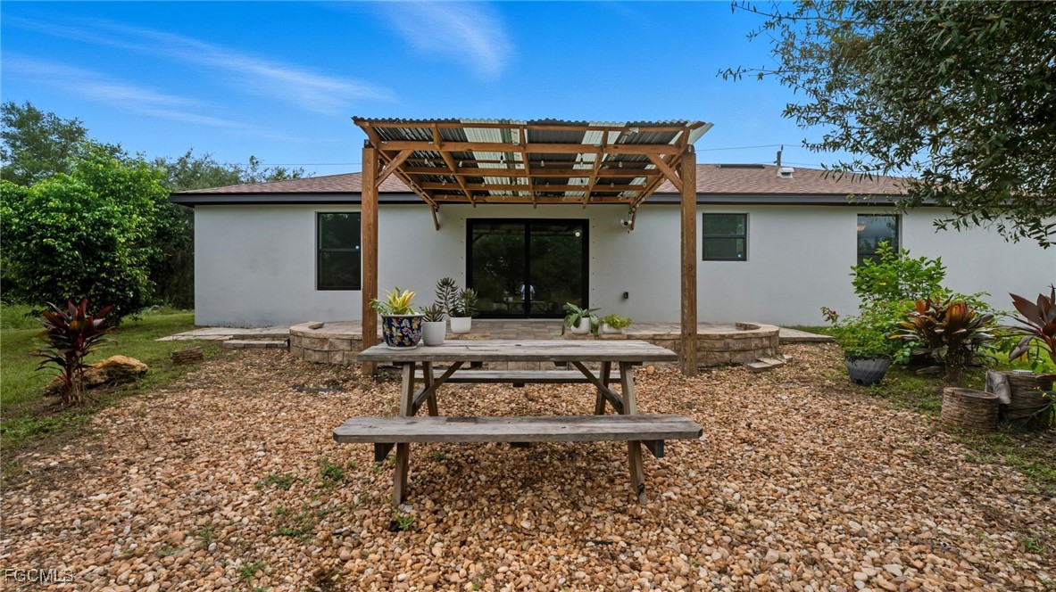 2701 East 18th Street Lehigh Acres, FL 33972 - Photo 23 of 24 a view of a house with backyard and sitting area