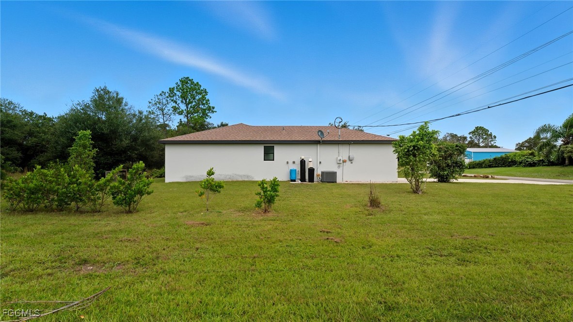 2701 East 18th Street Lehigh Acres, FL 33972 - Photo 24 of 24 a view of a house with a yard