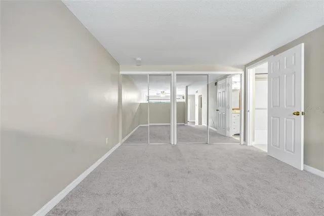 a kitchen with cabinets stainless steel appliances and sink