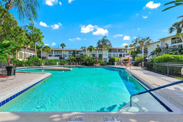 an aerial view of a houses with a lake view