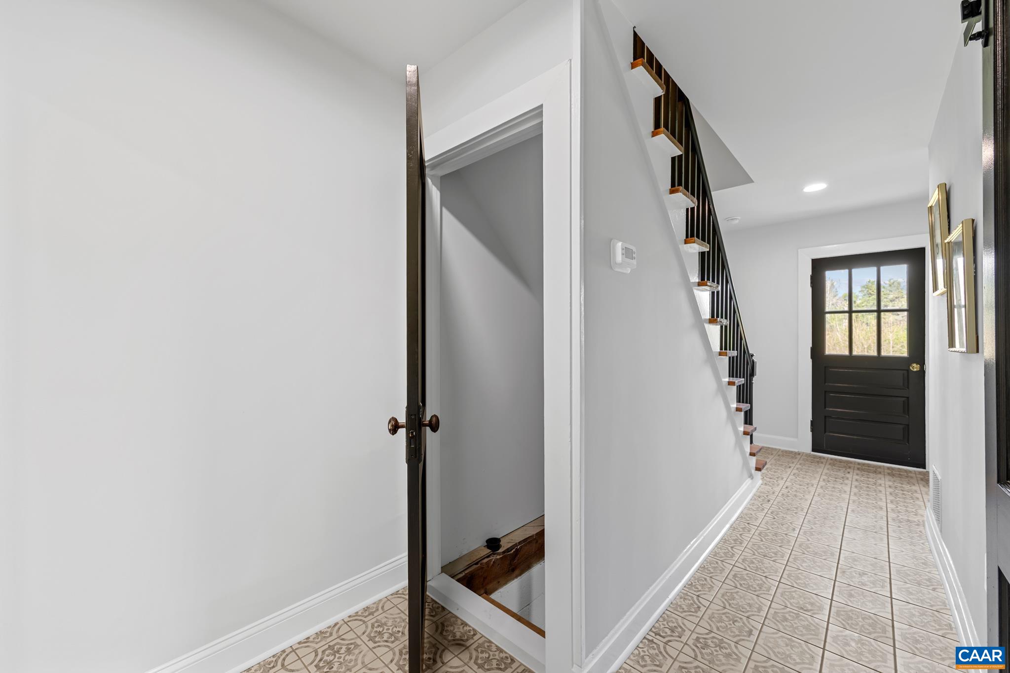 2733 Cedar Lane Road Kents Store, VA 23084 - Photo 23 of 43 The tiled rear entry hallway offers a durable and stylish transition space from the back door into the home, providing both practicality and easy maintenance for everyday use