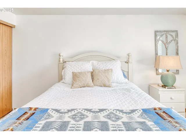 a large white bed in a white room