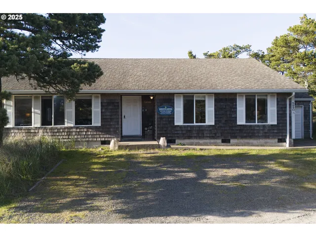a view of a house with swimming pool and a yard