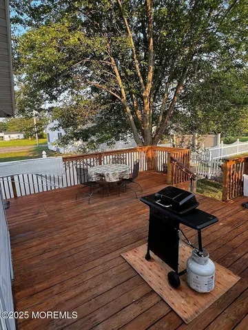 a view of a table and chairs on the roof deck