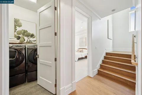 a spacious bathroom with a double vanity sink and a mirror
