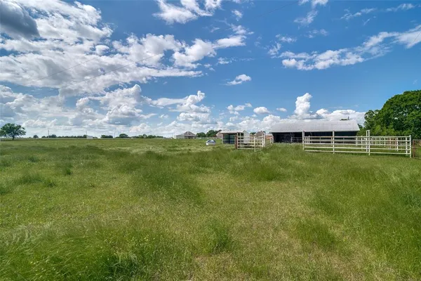 a view of a golf course with a lake