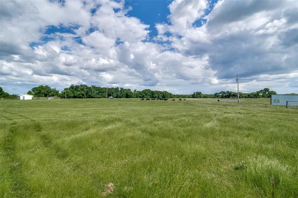 a view of a golf course with a big yard