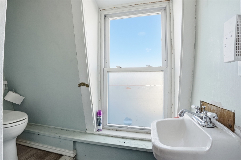 621 2nd Street Fall River, MA 02721 - Photo 19 of 42 a bathroom with a sink and a toilet