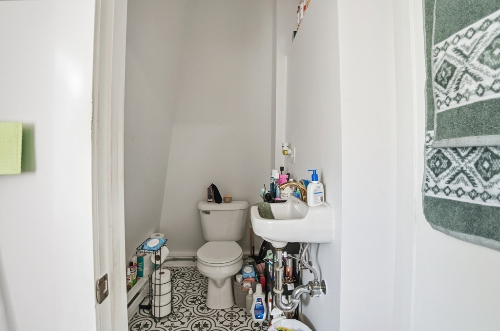 621 2nd Street Fall River, MA 02721 - Photo 20 of 42 a bathroom with a toilet and a sink