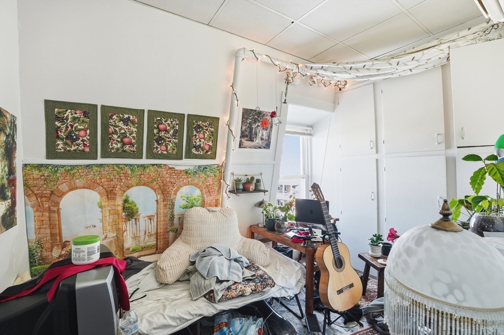 621 2nd Street Fall River, MA 02721 - Photo 21 of 42 a living room with furniture and flower vase