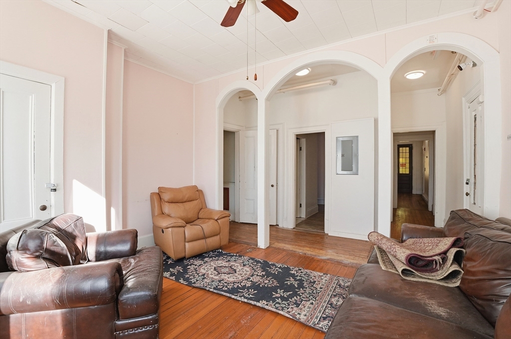 621 2nd Street Fall River, MA 02721 - Photo 26 of 42 a living room with furniture rug and a chandelier