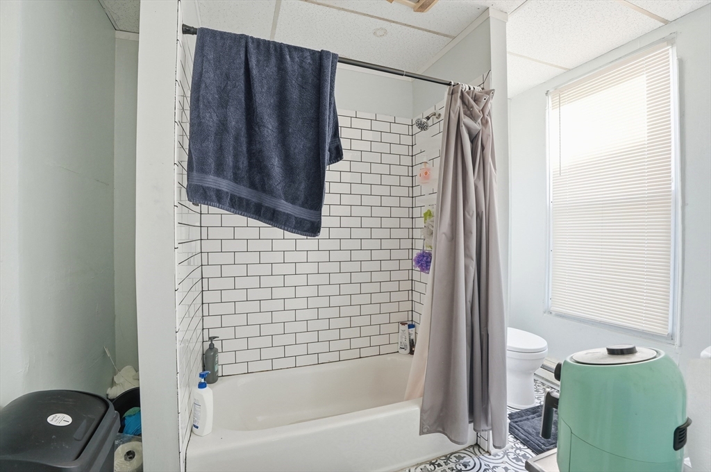 621 2nd Street Fall River, MA 02721 - Photo 27 of 42 a bathroom with a shower and a tub