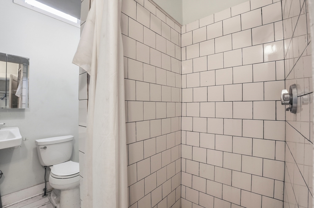621 2nd Street Fall River, MA 02721 - Photo 28 of 42 a bathroom with a toilet and a shower