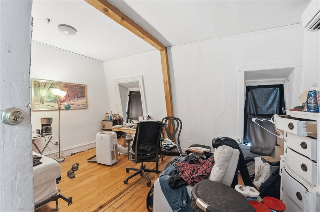 621 2nd Street Fall River, MA 02721 - Photo 31 of 42 a living room with furniture a flat screen tv and a mirror