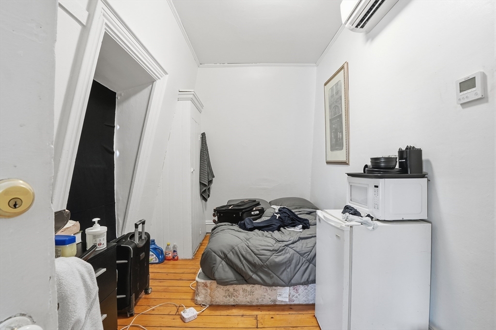 621 2nd Street Fall River, MA 02721 - Photo 32 of 42 a view of walk in closet with clothes and shoes