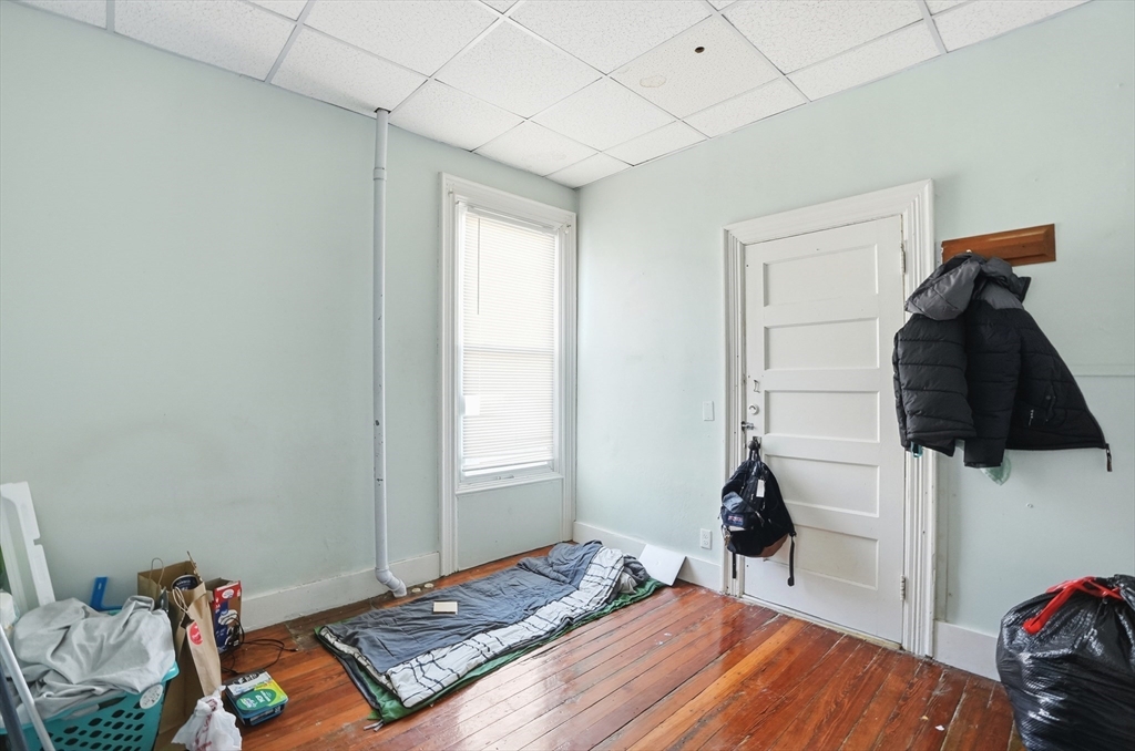 621 2nd Street Fall River, MA 02721 - Photo 39 of 42 a bedroom with a bed and a window