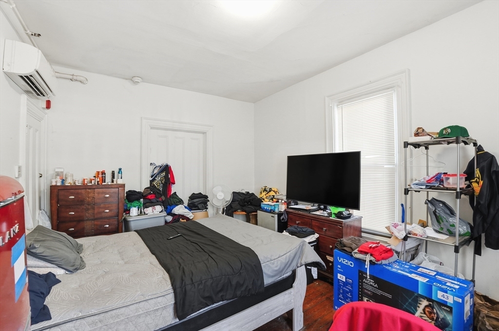 621 2nd Street Fall River, MA 02721 - Photo 42 of 42 a bed room with a bed and a flat screen tv