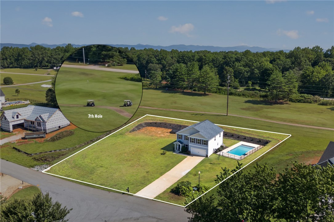 2007 Aberdeen Lane Walhalla, SC 29691 - Photo 3 of 41 Golf course living awaits, with a private pool and mountain views, offering serene relaxation.