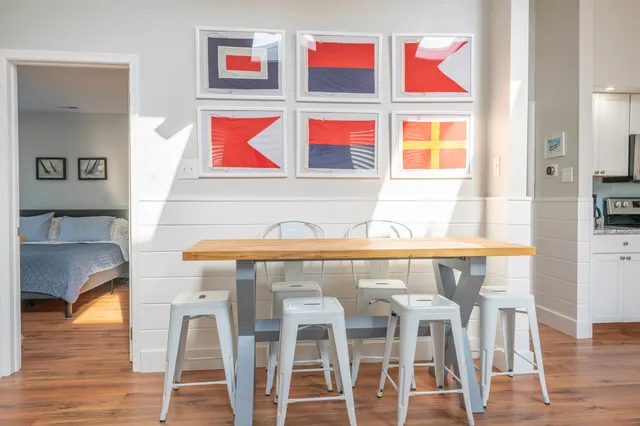 a view of a room with wooden floor and windows
