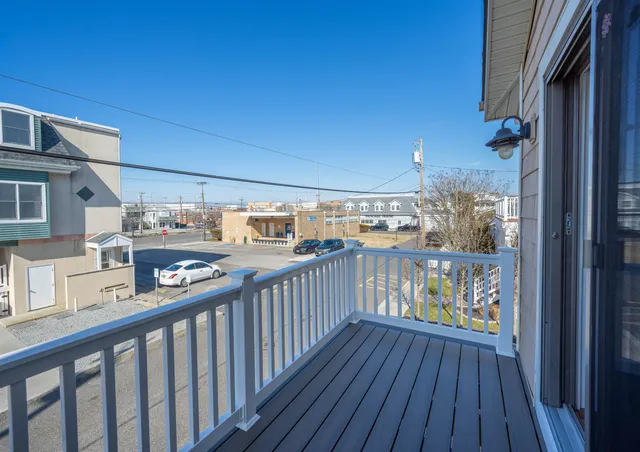 a view of a balcony with wooden floor