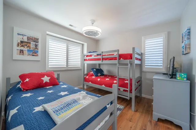 a bedroom with furniture and a window