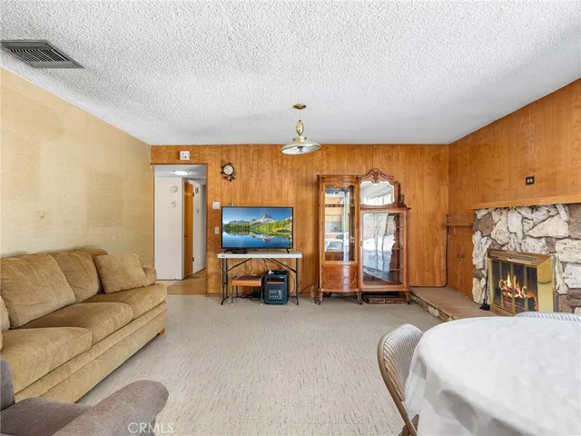 a bed room with a bed mirror and a tv