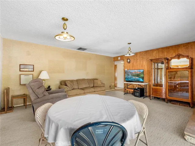 a kitchen with a refrigerator a stove a sink and a cabinets