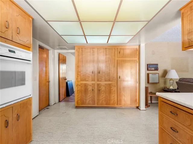 a view of a kitchen with furniture and a window