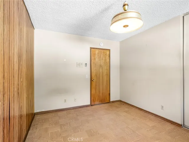 a white toilet sitting next to a shower curtain