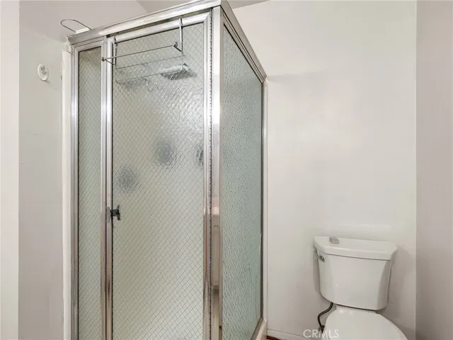 a bathroom with double sink and a mirror