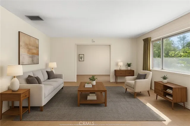 a living room with furniture and a large window