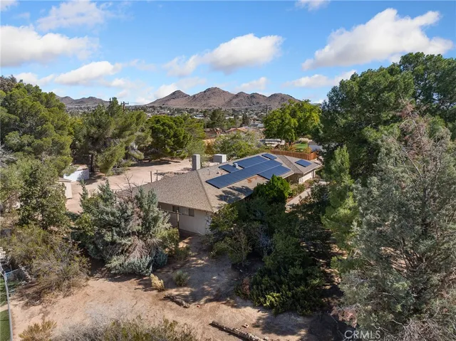 a view of a city with mountains in the background