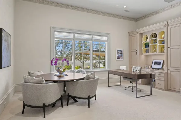 a dining room with furniture and window