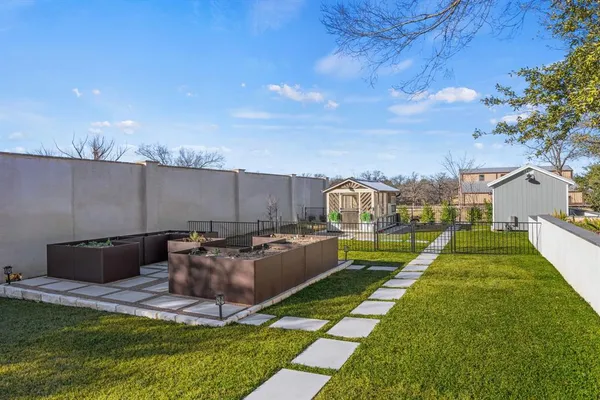 a view of a backyard with sitting area