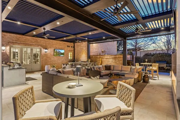 a outdoor dining space with furniture and outdoor view