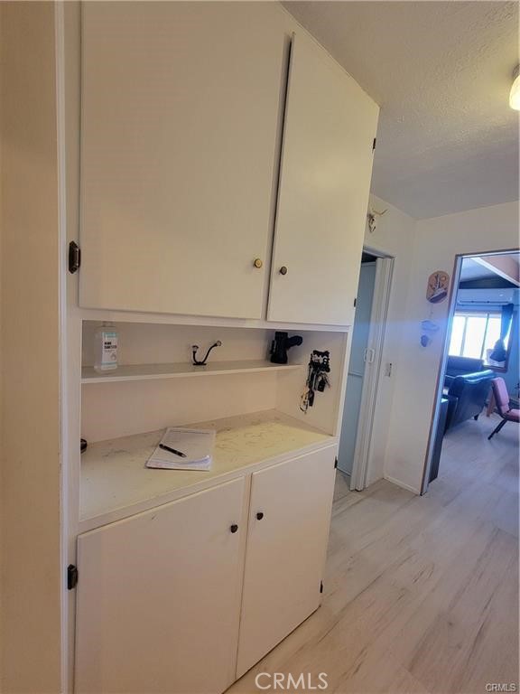 5566 Oleta Road Landers, CA 92285 - Photo 12 of 21 a view of a hallway with washer and dryer