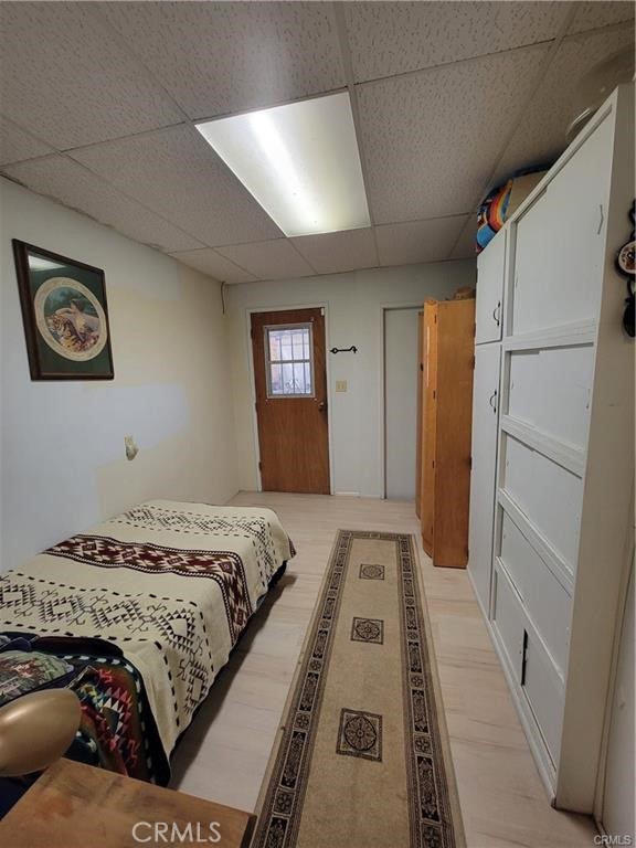 5566 Oleta Road Landers, CA 92285 - Photo 15 of 21 a bedroom with a bed and a walk in closet
