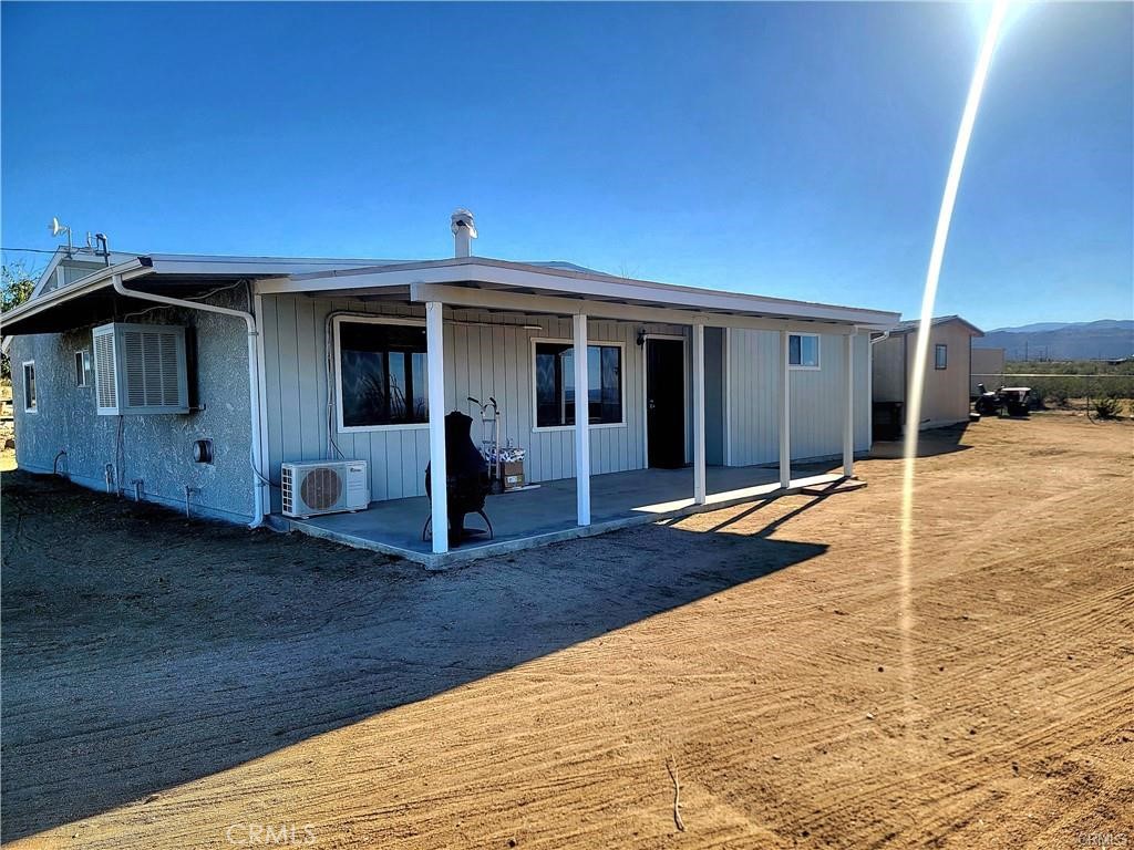 5566 Oleta Road Landers, CA 92285 - Photo 17 of 21 a view of a house with wooden fence