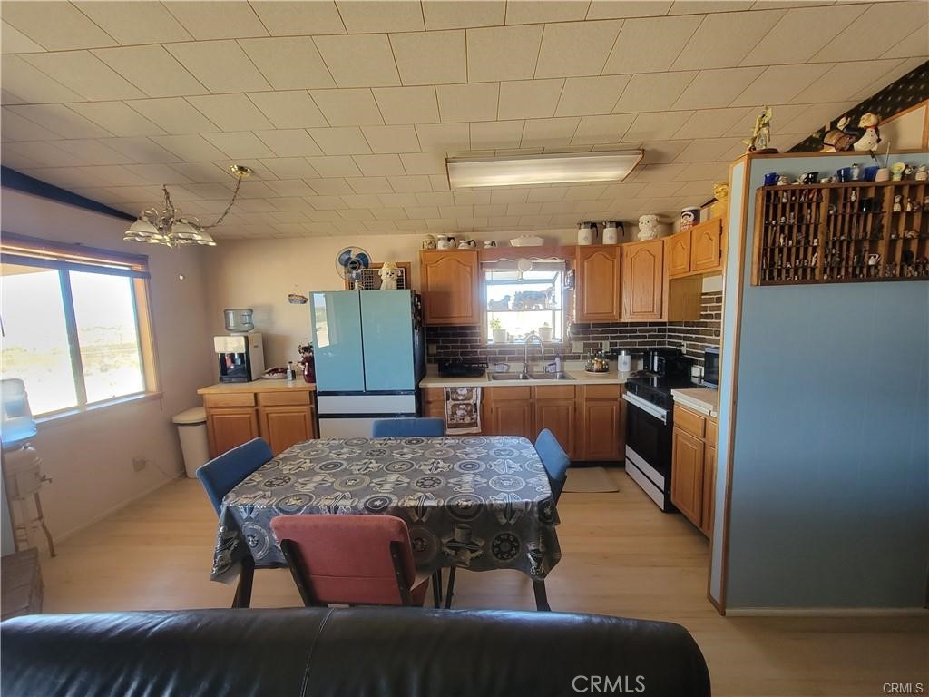 5566 Oleta Road Landers, CA 92285 - Photo 8 of 21 a kitchen with a table and chairs in it
