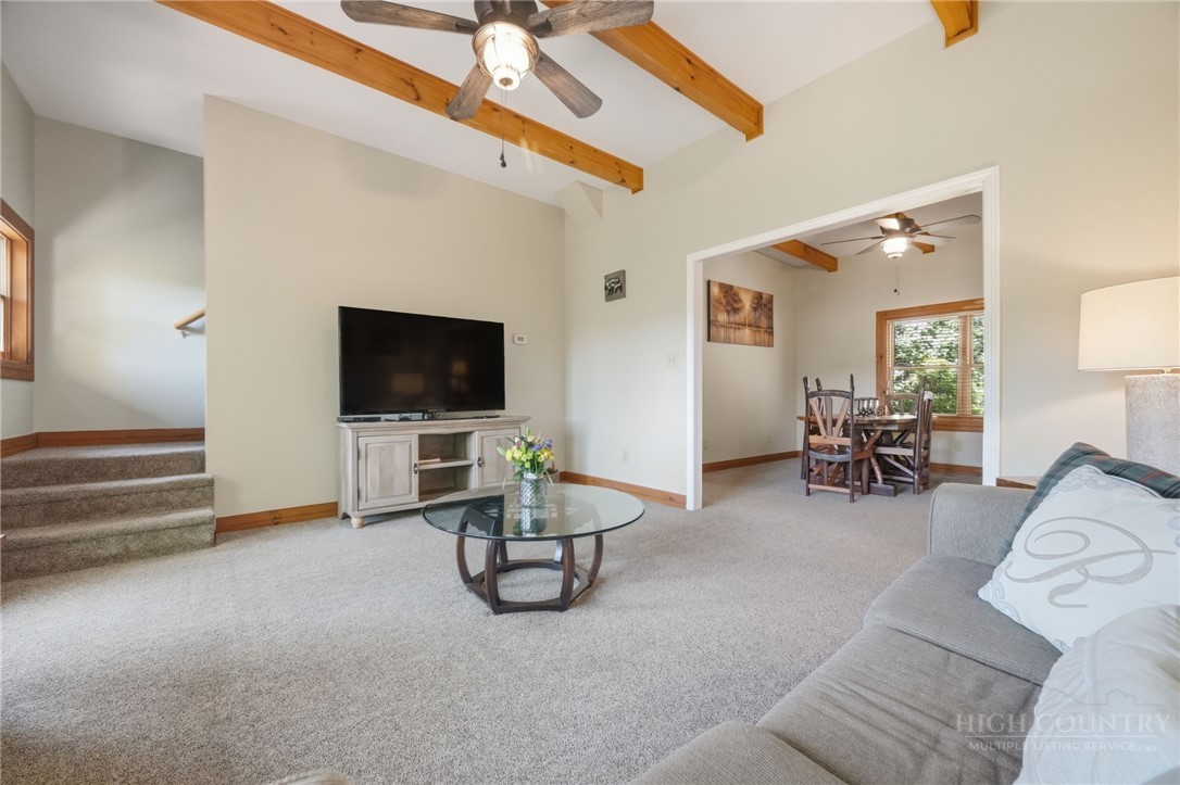 850 River Ridge Road Boone, NC 28607 - Photo 8 of 26 a living room with furniture and a flat screen tv