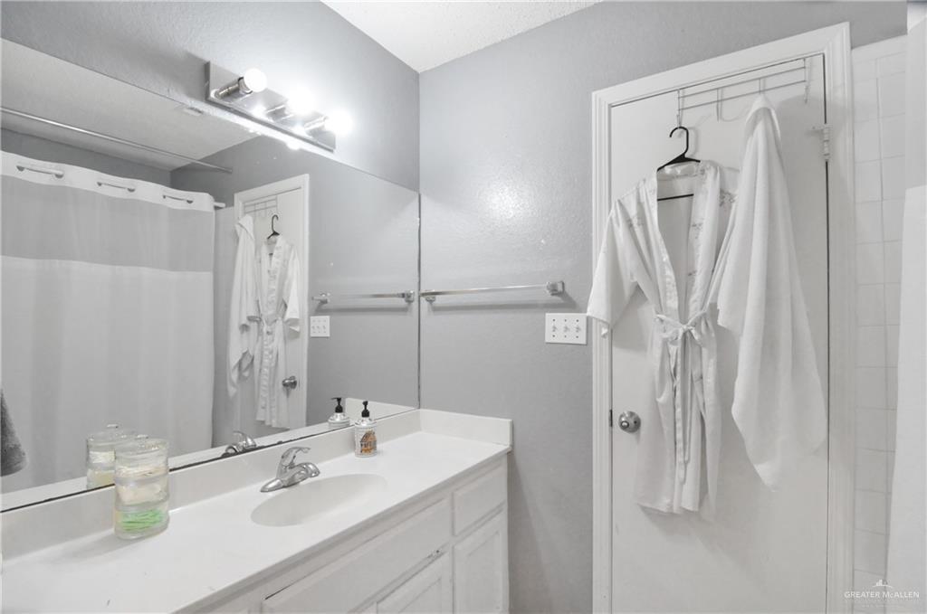 2020 Lemon Tree Court Edinburg, TX 78539 - Photo 13 of 16 a bathroom with a sink vanity and a mirror