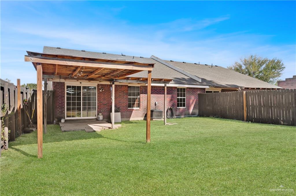 2020 Lemon Tree Court Edinburg, TX 78539 - Photo 16 of 16 a view of a house with a yard and wooden fence