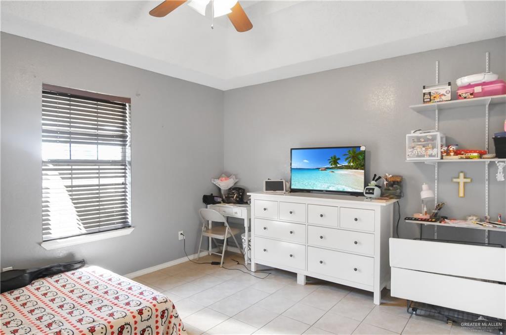 2020 Lemon Tree Court Edinburg, TX 78539 - Photo 8 of 16 a bedroom with a dresser and a window