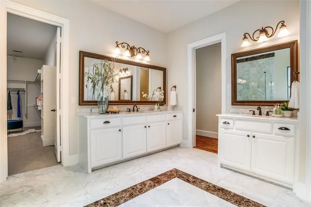 a spacious bathroom with a sink and a mirror