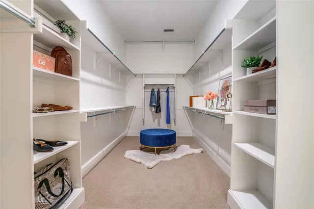 a room with cabinets and book shelf