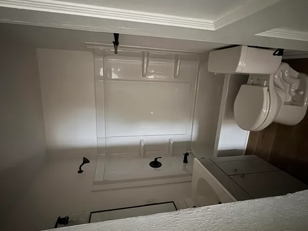 a bathroom with a mirror and a shower