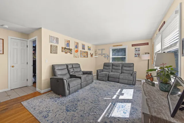 a living room with furniture and a rug